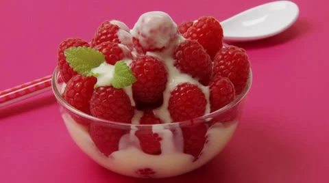 Raspberries with custard Stock Footage 8572246