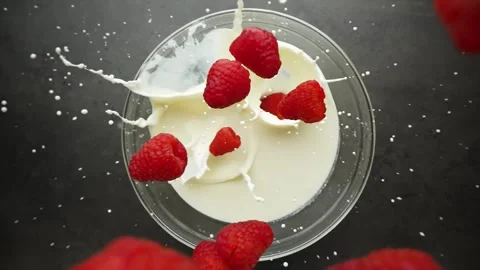 Raspberries fall from above in the late Stock Footage 262187022