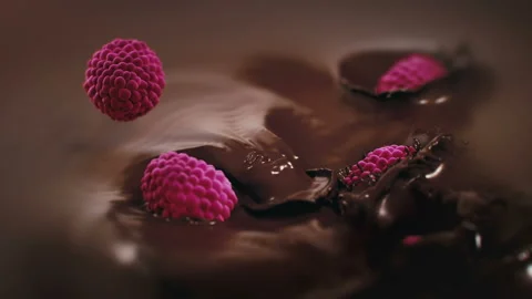 Raspberries Falling Into Liquid Chocolate in 4K Super slow motion Stock Footage 139911038