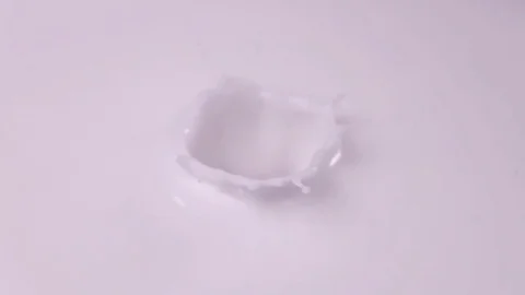 Raspberries falling into milk in slow motion. Raspberry falls into Yogurt in Stock Footage 79050685