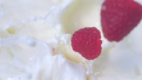 Raspberries falling into milk with splashes in slow motion 300fps Stock-Footage 287998667