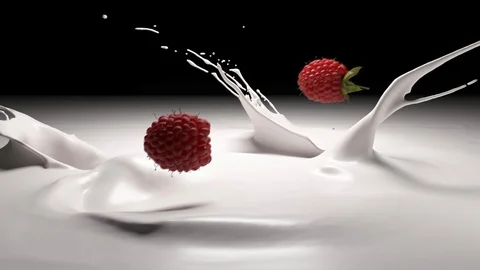 Raspberries falling into yogurt Stock Footage 104715397
