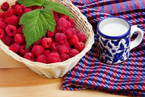 Raspberries with milk Stock Photos