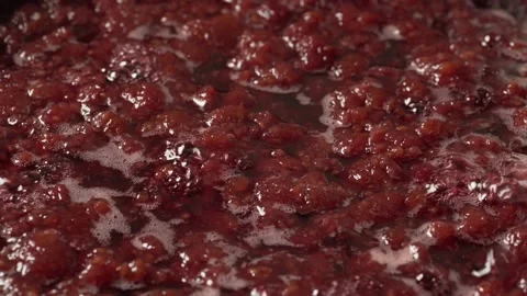 Raspberries in pan for jam. Process of cooking, boiling berries for canning Stock Footage 136123750