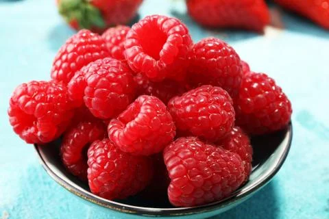 Raspberries. Raspberry on blue background. Summer and healthy food concept Stock Photos