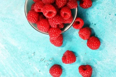 Raspberries. Raspberry on blue background. Summer and healthy food concept Stock Photos