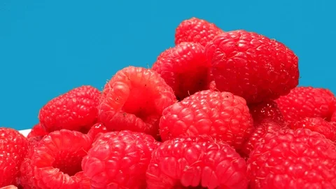 Raspberries rotate in Macro Close Up including RAW footage and Green box Vers Stock-Footage 126669647