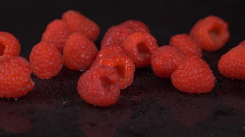 Raspberries Rotating over black Background. Fruit,  Raspberries, berries Video stock 127906551
