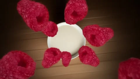 Raspberries spiraling and falling in the white milk  bowl slow motion Stock Footage 258478242