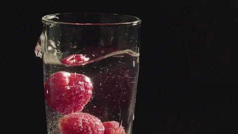 Raspberries in water Stock Footage