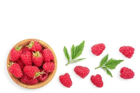 Raspberries in wooden bowl with leaves isolated on white background with copy Stock Photos