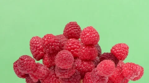 Raspberry abstract design from fresh ripe berries on a green background. Stock Footage 237859514