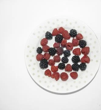RASPBERRY AND BLACKBERRY on a white background with space for the text Stock Photos