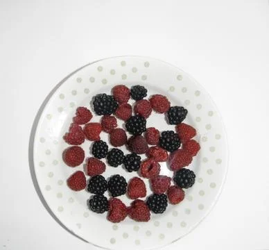 RASPBERRY AND BLACKBERRY on a white background with space for the text Stock Photos