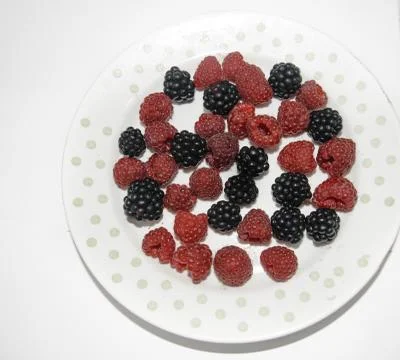 RASPBERRY AND BLACKBERRY on a white background with space for the text Stock Photos