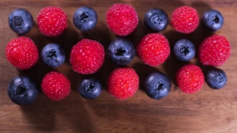 Raspberry and blueberry berries close up. Healthy nutrition. Stop motion. Stock Footage 119640531