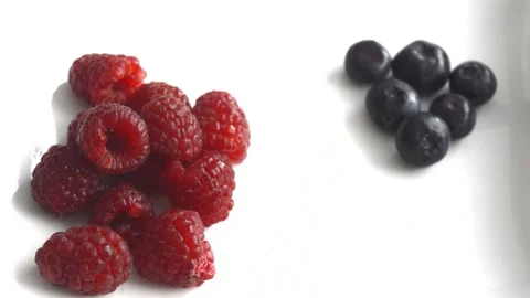 Raspberry and blueberry Stock Footage 130379132
