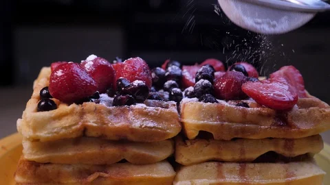 Raspberry and blueberry tart covered with powdered sugar Stock-Footage 129073328