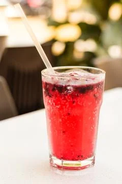Raspberry and Sprite lemonade with ice cubes in a glass Stock Photos