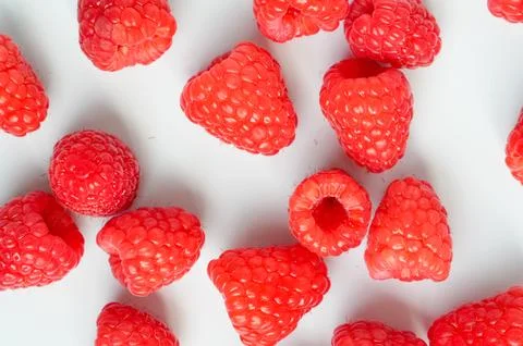 Raspberry background. Raspberries on a white background. Fruits on the table Stock Photos