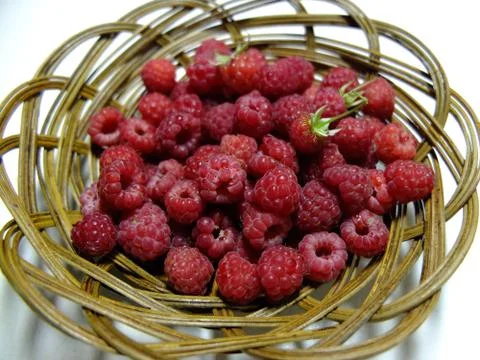 Raspberry in the basket. Stock Photos
