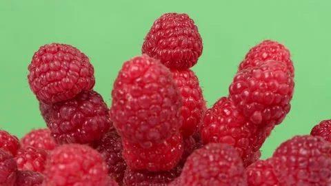 Raspberry berries on green background. Side view. Extrem close-up Stock Footage 164476424