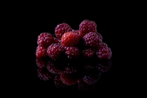 Raspberry on black background Stock Photos