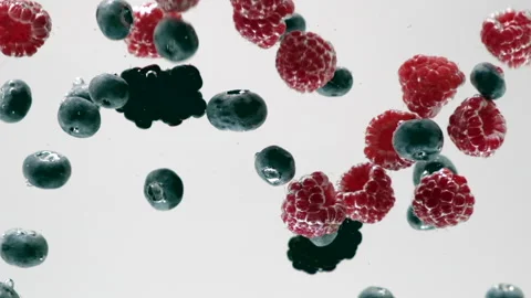 Raspberry, blueberry and mulberry falling into transparent water. Berry Stock Footage 134896850