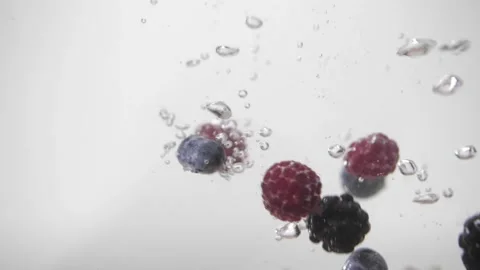 Raspberry, blueberry, raspberries falling in to the watter 動画素材 156512702