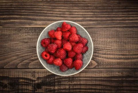 Raspberry in bowl Stock Photos
