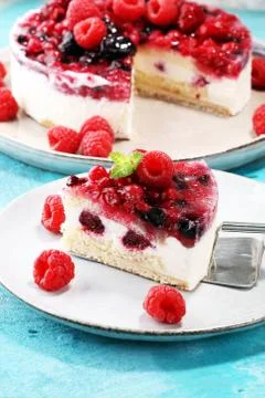 Raspberry cake and many fresh raspberries Stock Photos