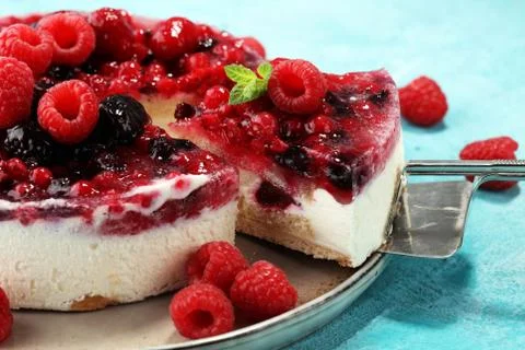 Raspberry cake and many fresh raspberries Stock Photos