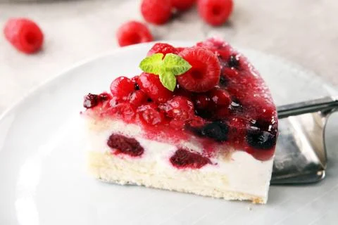 Raspberry cake and many fresh raspberries Stock Photos