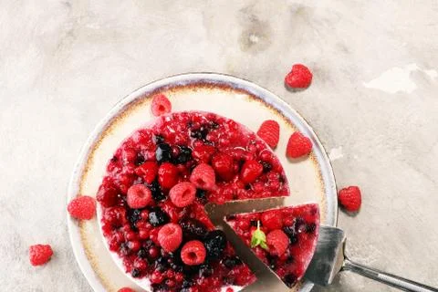 Raspberry cake and many fresh raspberries Stock Photos