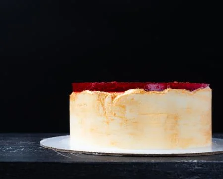 Raspberry cake on black board Stock Photos