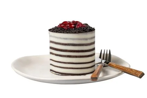 Raspberry cake. Delicious chocolate covered cake on a white background. Close Stock Photos