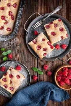 Raspberry cake known as Bublanina sprinkled with powdered sugar Stock Photos