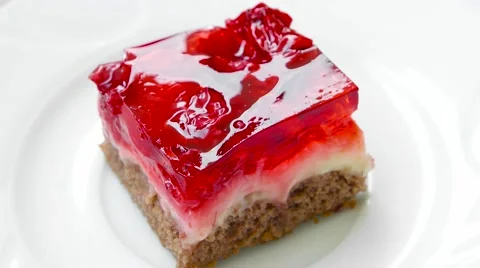 Raspberry cake rotates on white plate, top view Stock Footage 54227429