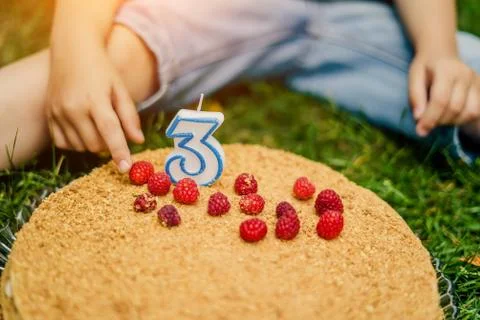 Raspberry cake for a three-year-old child close-up Stock Photos