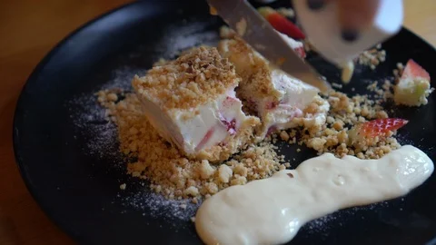 Raspberry cheese cake rustic style with crust and hand pouring sauce Stock Footage 115888414