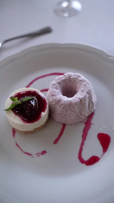 Raspberry Cheesecake with Ice Cream on Elegant Table Stock Footage 336272446