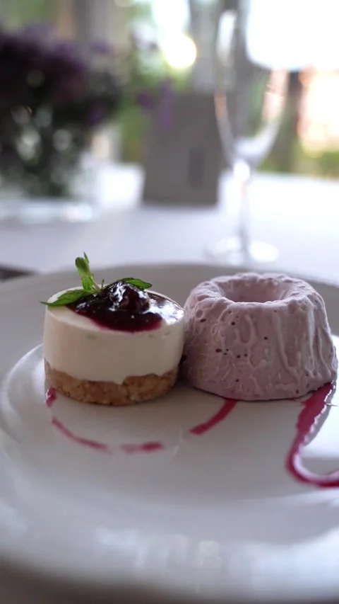 Raspberry Cheesecake with Ice Cream on Elegant Table Stock Footage 336272452
