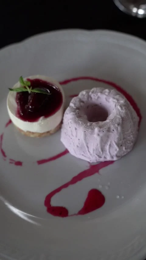 Raspberry Cheesecake with Ice Cream on Elegant Table Stock Footage 336272499