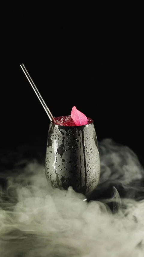 Raspberry cherry alcoholic cocktail on a black background Video stock 221568037