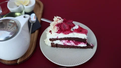 Raspberry chocolate layer cake with cream and fresh berries at cafe Stock Footage 345028855