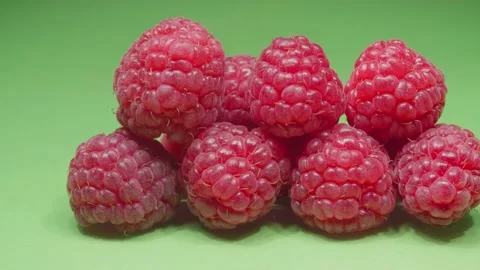 Raspberry close-up. Green background. 4K video. Видео 140634752
