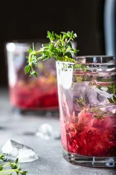 Raspberry cocktail with thyme. Stock Photos