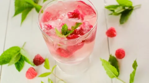 Raspberry cocktail.Splashes and drops of a refreshing cocktail. Stock Footage 182514442