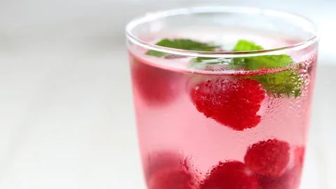 Raspberry cocktail.Splashes and drops of a Summer drink. Stock Footage 189128139