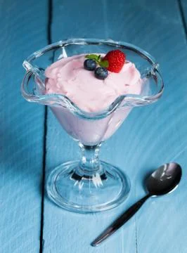 Raspberry cream dessert with mint and fruits Stock Photos